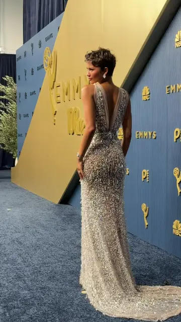 HER in custom Prada with a Rolex watch and Mikimoto pearls for the #emmys