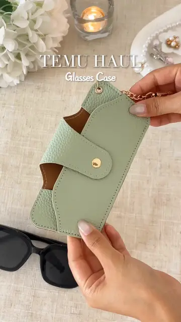 Keep your glasses safe and organized with this portable case featuring a fashio…